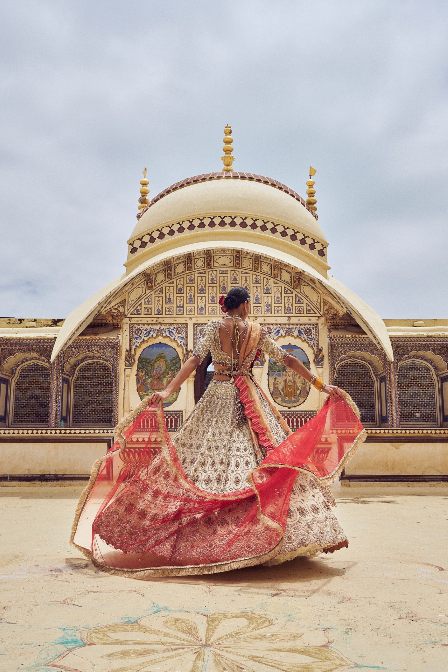 GOLD TISSUE LEHENGA CHOLI WITH A PEACH TISSUE DUPATTA