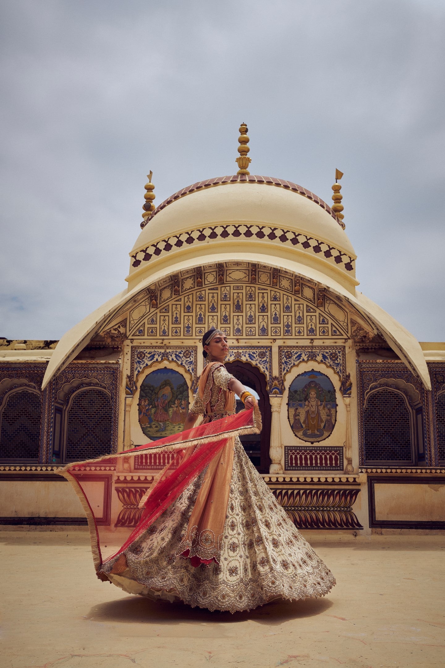GOLD TISSUE LEHENGA CHOLI WITH A PEACH TISSUE DUPATTA