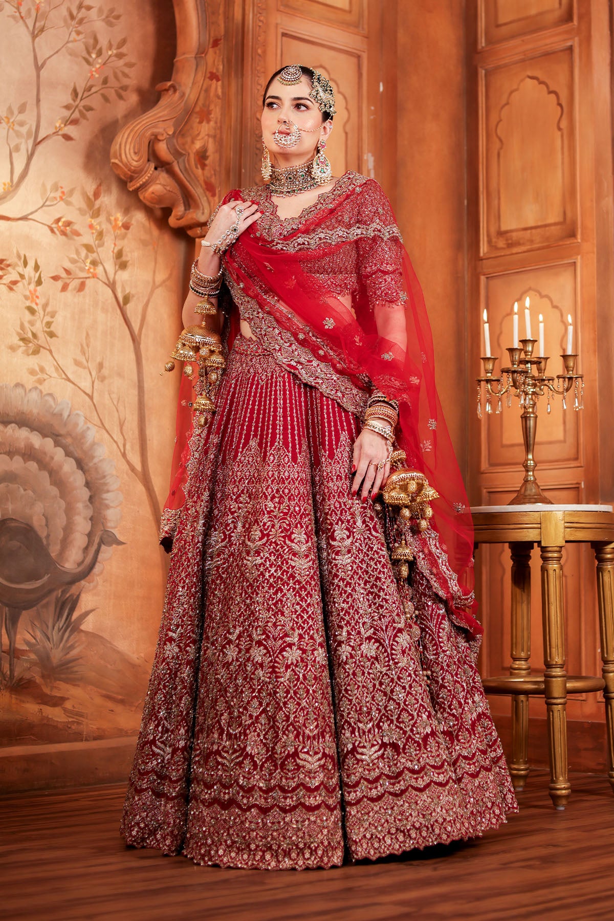Jannat Khan In Blood Red Raw Silk Lehenga Choli and Belt with Tulle Dupatta with an Optional Lighter Second Dupatta