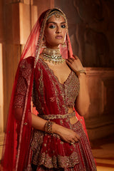 Jannat Khan In Blood Red Raw Silk Lehenga Choli and Belt with Tulle Dupatta with an Optional Lighter Second Dupatta