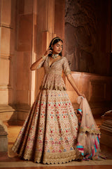 Blush Pink Raw Silk Lehenga with a Peplum Top and Tulle Dupatta