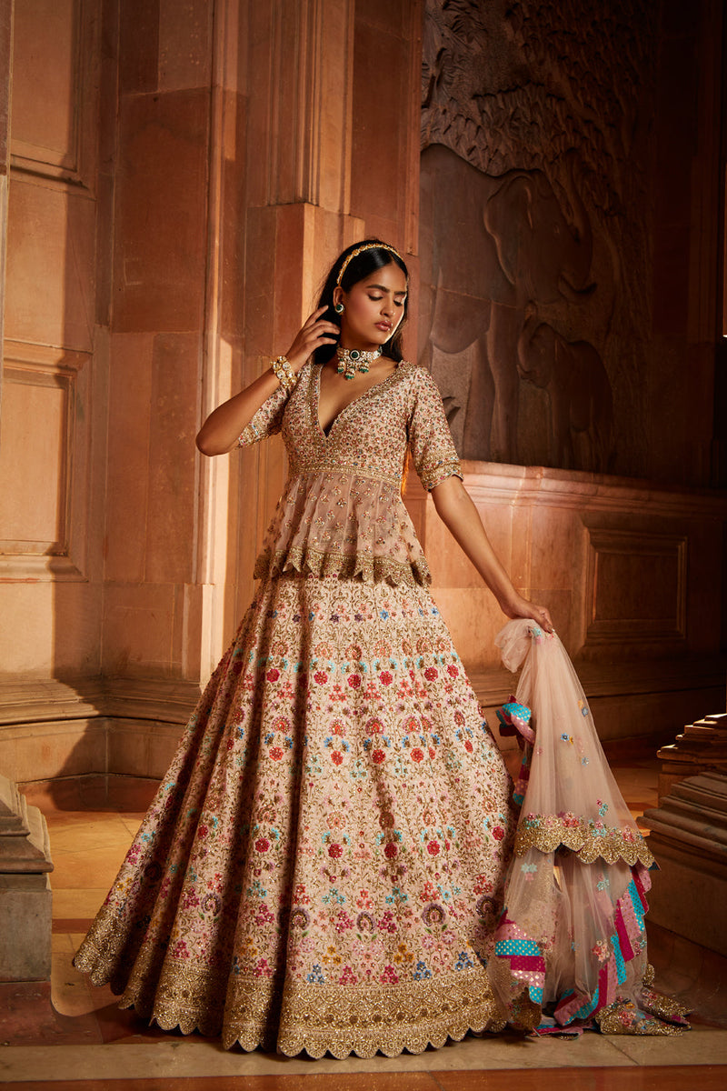 Blush Pink Raw Silk Lehenga with a Peplum Top and Tulle Dupatta