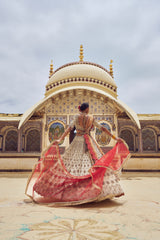 GOLD TISSUE LEHENGA CHOLI WITH A PEACH TISSUE  DUPATTA
