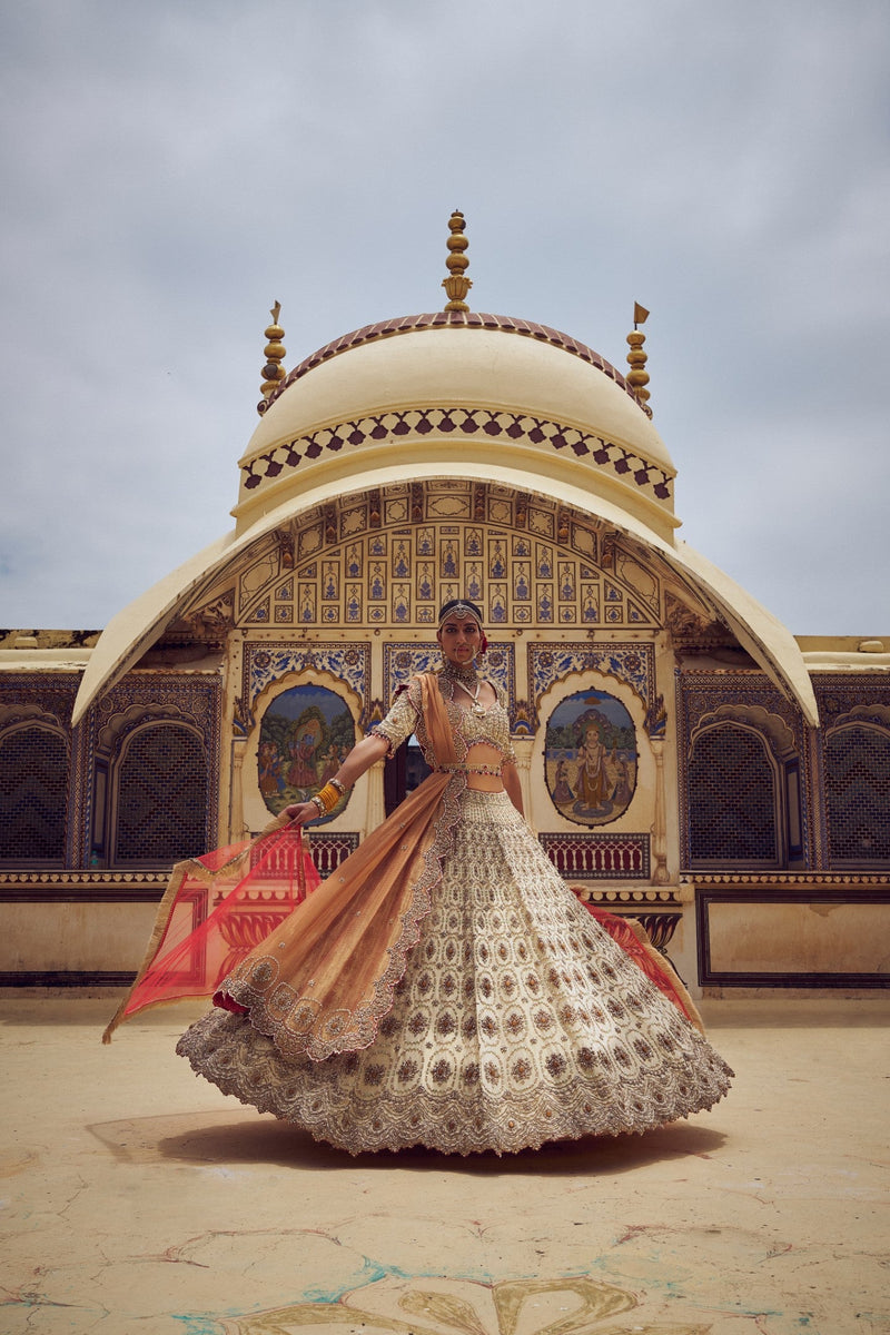 GOLD TISSUE LEHENGA CHOLI WITH A PEACH TISSUE  DUPATTA