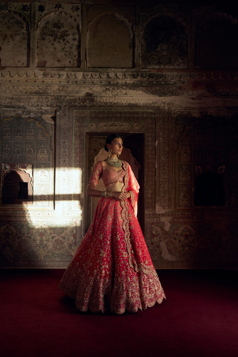 RED TO CORAL OMBRE DYED RAW SILK LEHENGA WITH A CORAL CHOLI AND RED DUPATTA