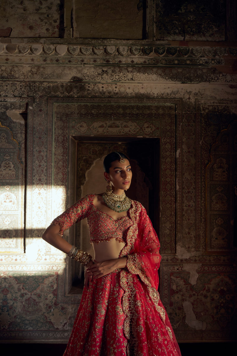 RED TO CORAL OMBRE DYED RAW SILK LEHENGA WITH A CORAL CHOLI AND RED DUPATTA