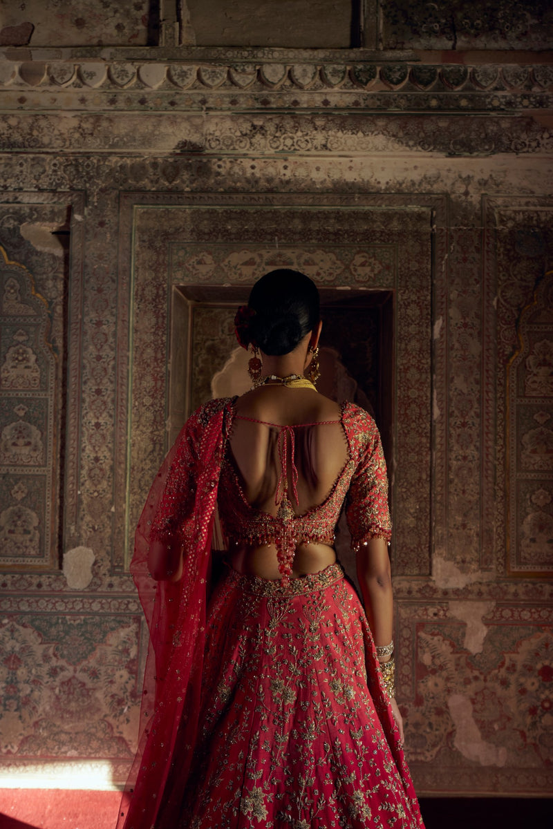 RED TO CORAL OMBRE DYED RAW SILK LEHENGA WITH A CORAL CHOLI AND RED DUPATTA