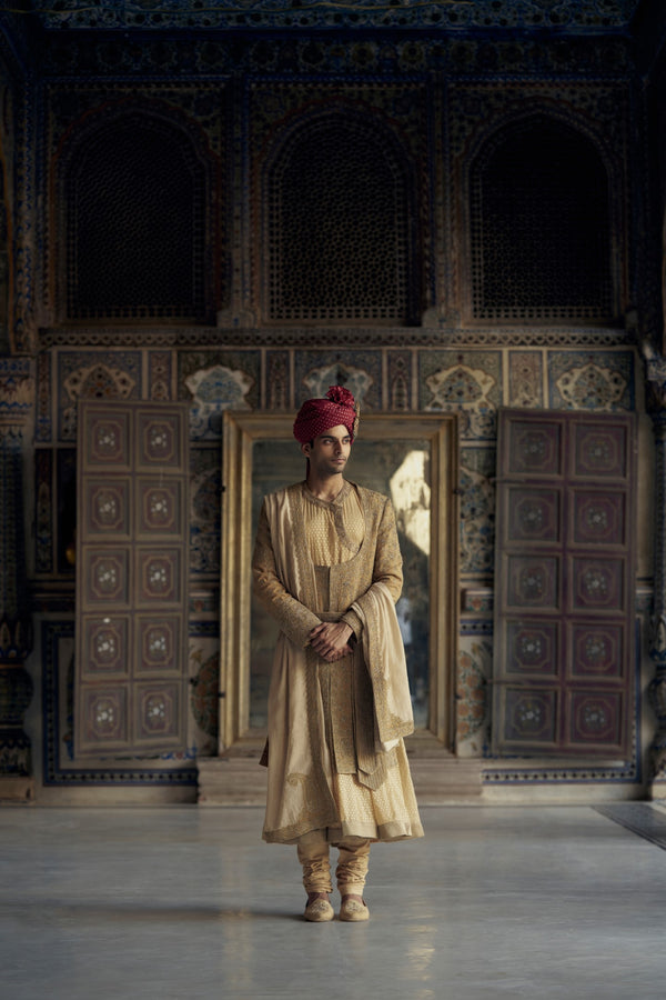 GOLD MATKA SILK ANGRAKHA STYLE SHERWANI WITH A CHANDERI BOOTI CHOGA AND CHURIDAR