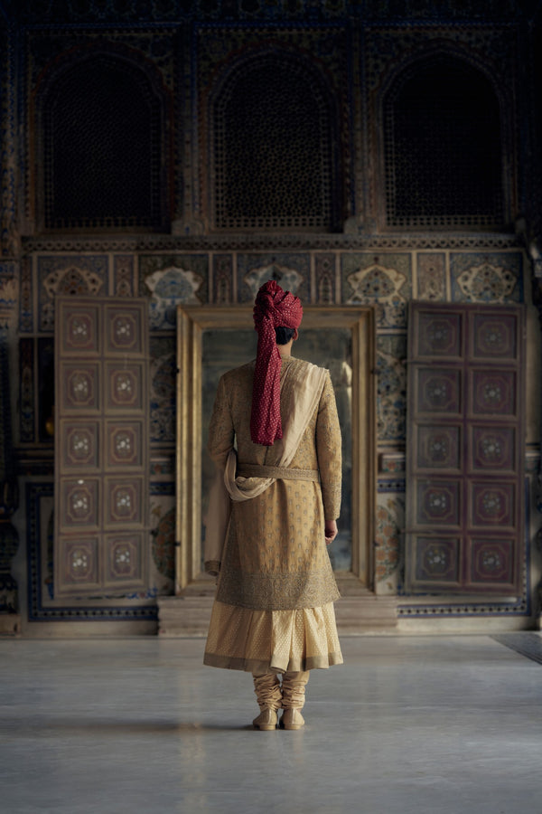 GOLD MATKA SILK ANGRAKHA STYLE SHERWANI WITH A CHANDERI BOOTI CHOGA AND CHURIDAR