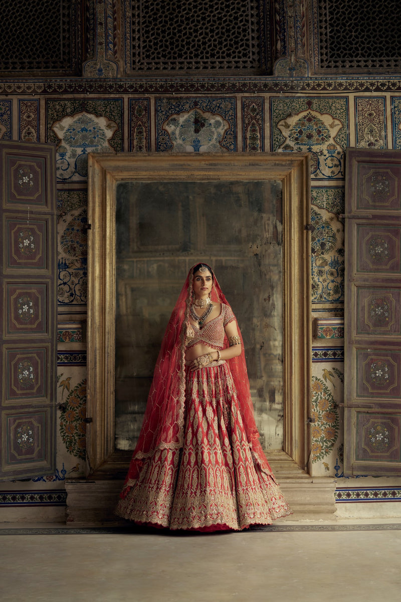 RED RAW SILK LEHENGA CHOLI SET WITH A HEAVY NET DUPATTA