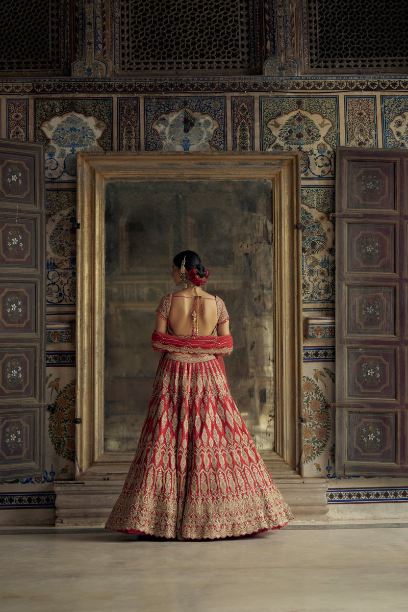 RED RAW SILK LEHENGA CHOLI SET WITH A HEAVY NET DUPATTA