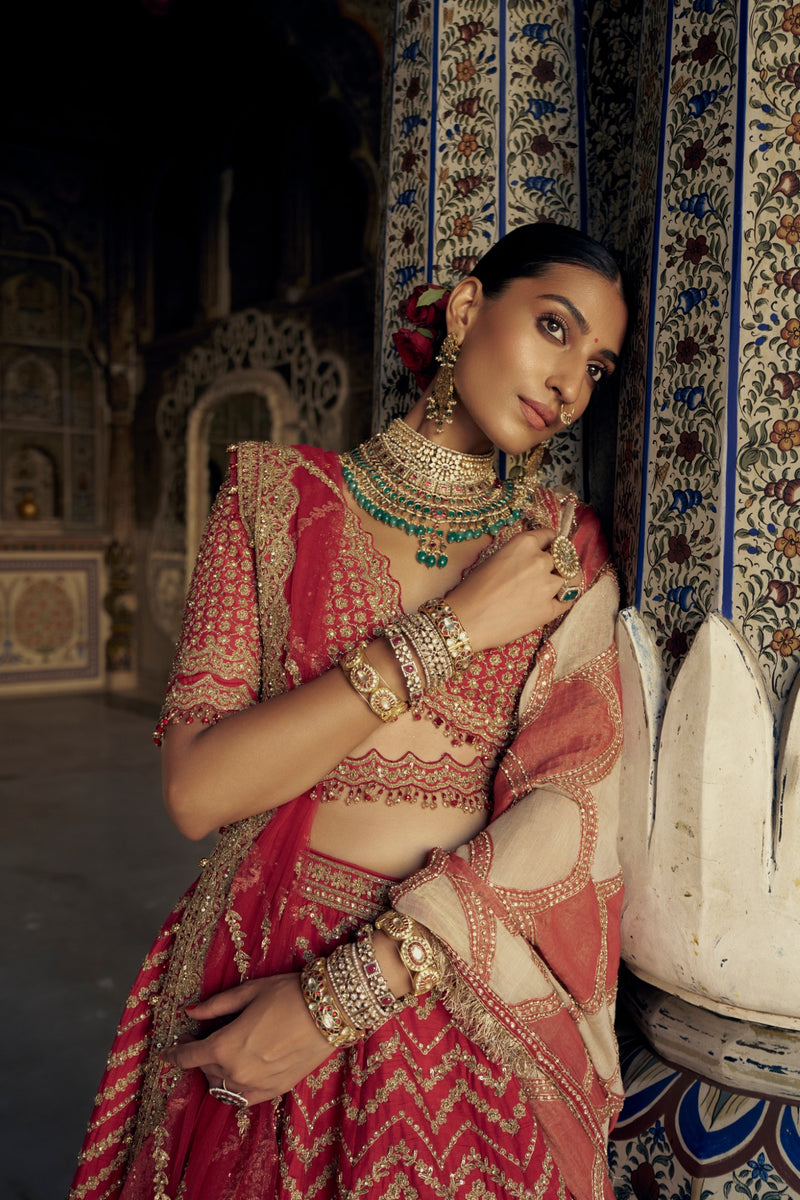 RED RAW SILK LEHENGA CHOLI WITH A NET DUPATTA