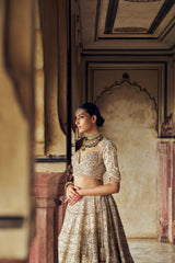 GOLD RAW SILK LEHENGA CHOLI WITH A NET DUPATTA