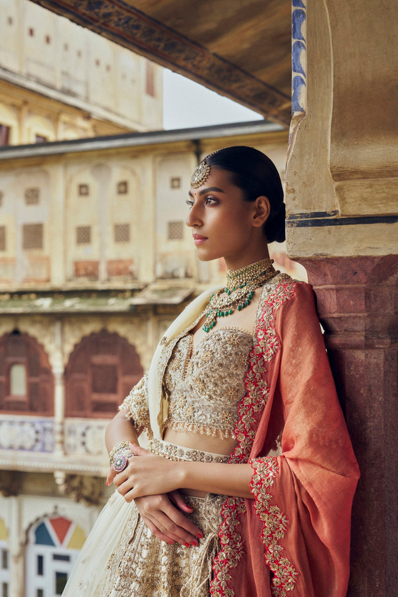 GOLD RAW SILK LEHENGA CHOLI WITH A NET DUPATTA