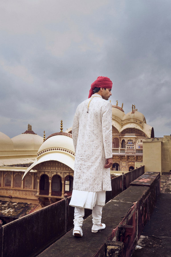 IVORY RAW SILK SHERWANI WITH A COTTON SILK CHOGA AND CHURIDAR