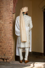 Ivory Taffeta Achkan and Belt all over Embroidered with Monga Kurta and Churidar